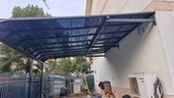 海南新型透光阳光板雨棚_海南悦民铝合金遮阳雨棚厂家